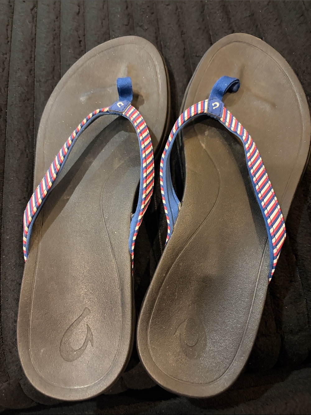 OluKai Flip Flops with Blue, White and Red Striped Straps